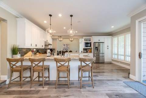 A bright kitchen with a white island