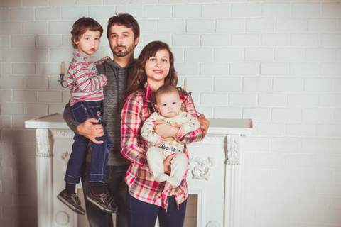 A smiling family together at home