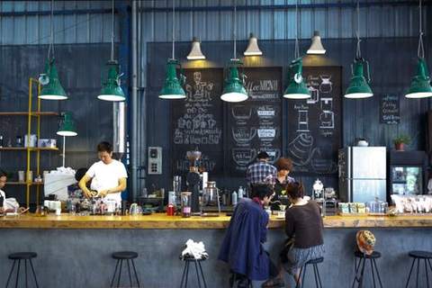 A busy coffee bar with baristas at work