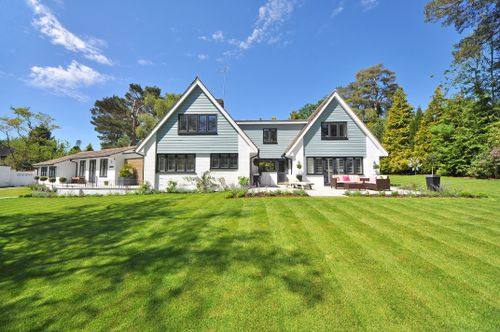 A freshly mowed lawn in front of a home