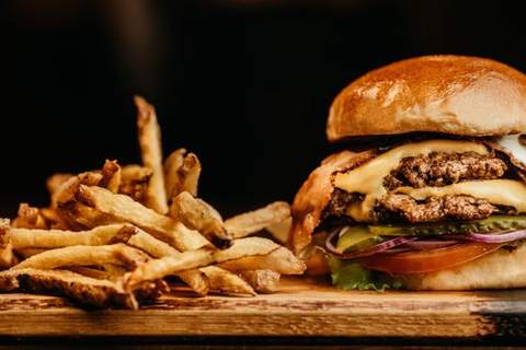 A burger with fries